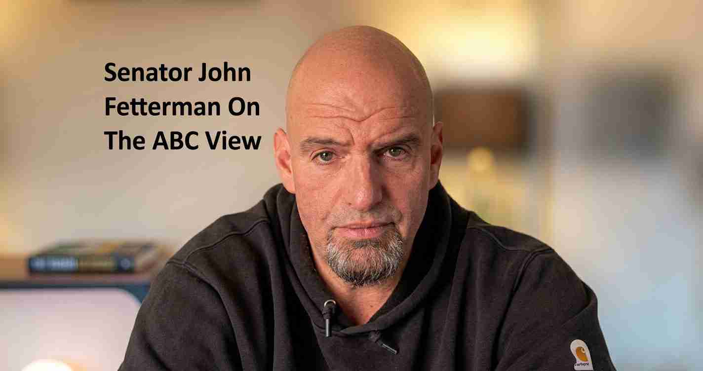 A bald man with a gray goatee wearing a black hoodie, sitting indoors; text overlay reads 'Senator John Fetterman On The ABC View'.
