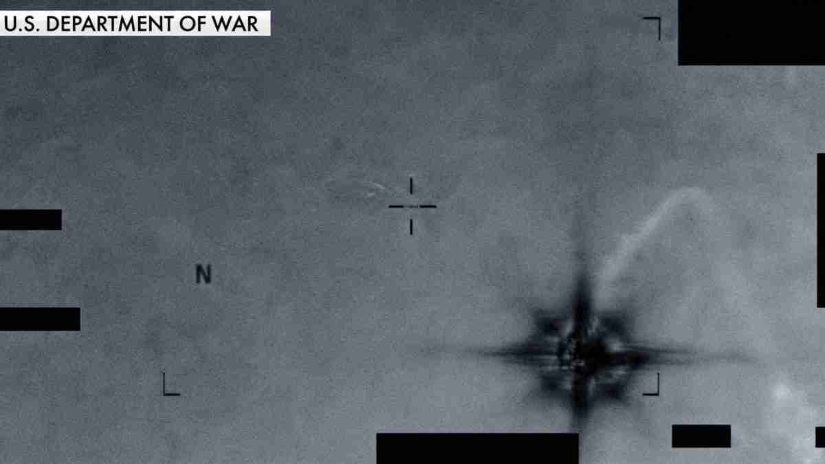 IR/night-vision target view with crosshair marks and explosion plume to the right, captioned 'U.S. DEPARTMENT OF WAR' at the top left