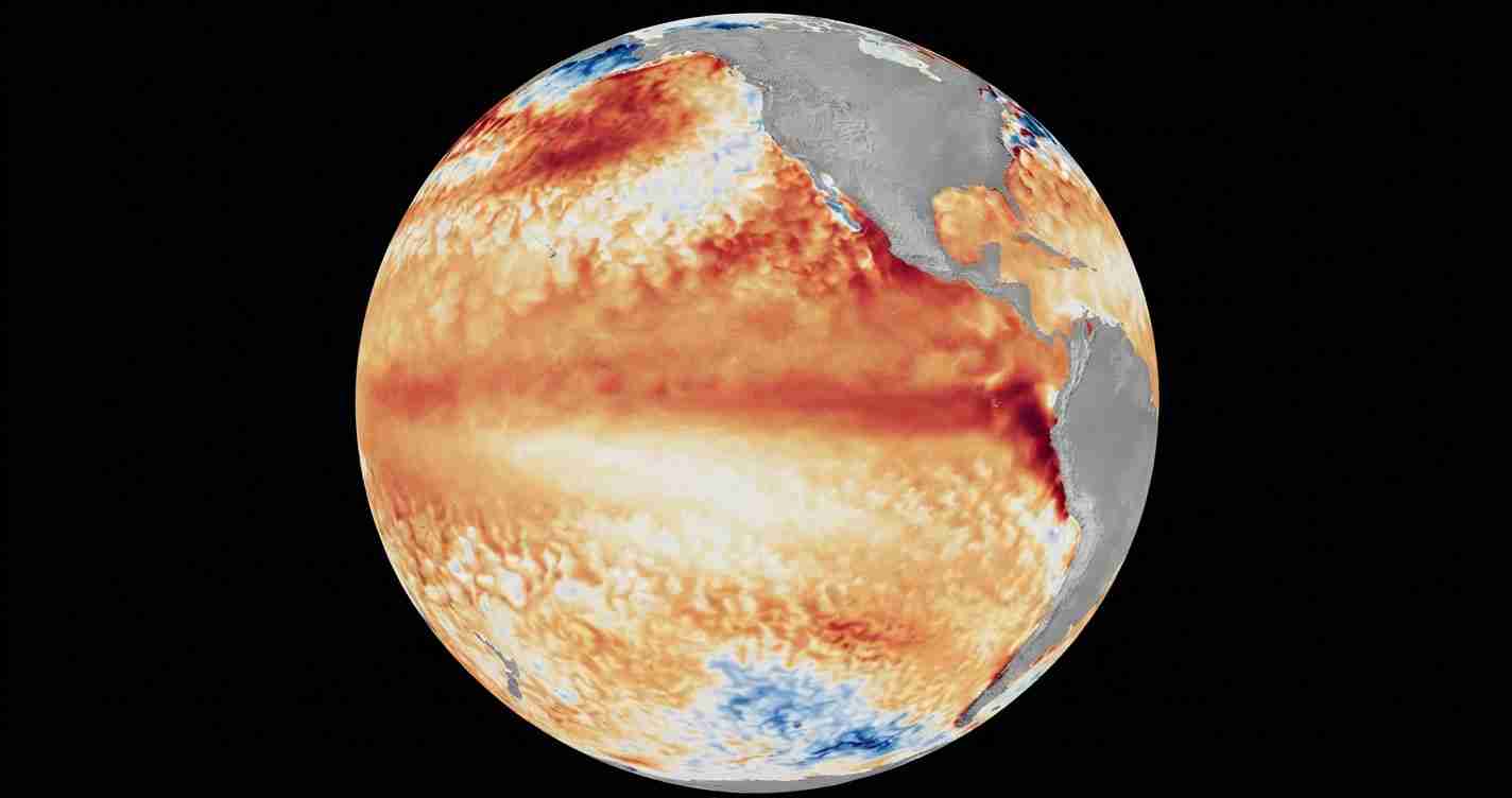 False-color satellite image of Earth showing warm sea-surface temperature anomalies across the equator in orange and red hues.